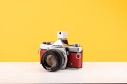 Olympus OM-1 35mm SLR Film Camera With Olympus OM-System G.Zuiko Auto-S 50mm F1.4 Lens In Red