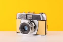 Halina Paulette Electric 35mm Viewfinder Film Camera With Halinar 45mm F2.8 F.C. Lens In Light Yellow